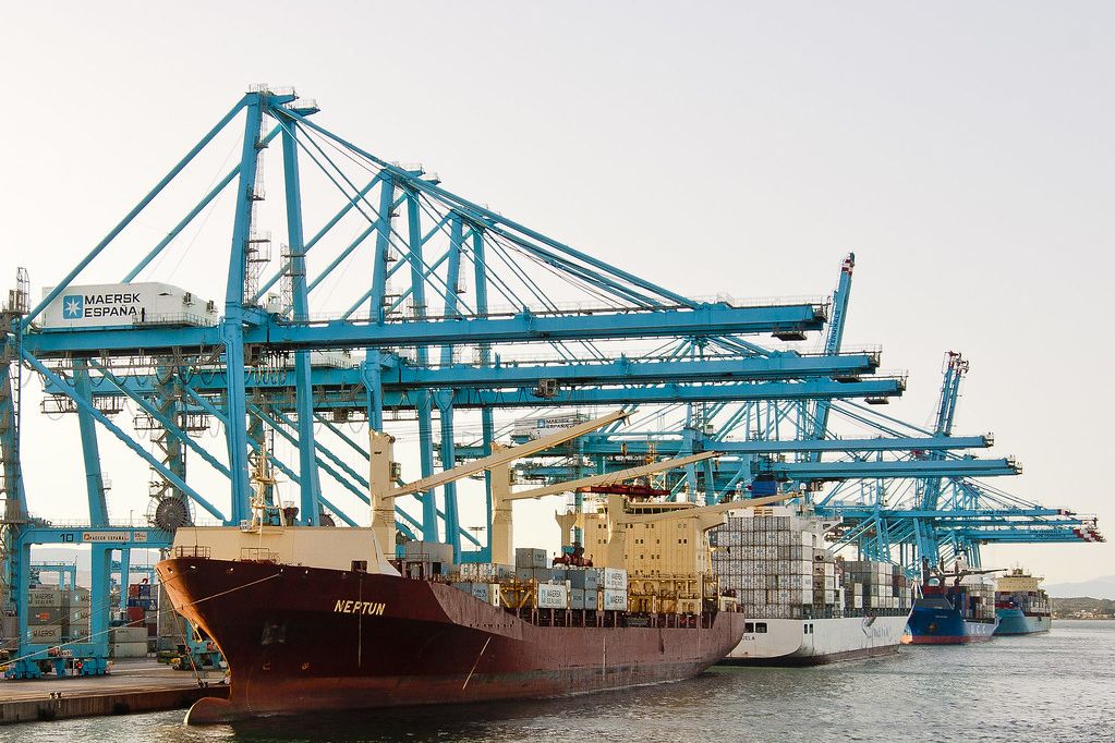 Container ship alongside blue gantry cranes at the Juan Carlos I dock, Algeciras
