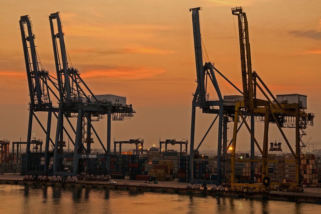 Silhouettes of container cranes at sunrise at Laem Chabang