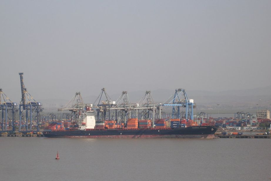 Container cranes of the Mumbai harbour area seen across the water from Elephanta