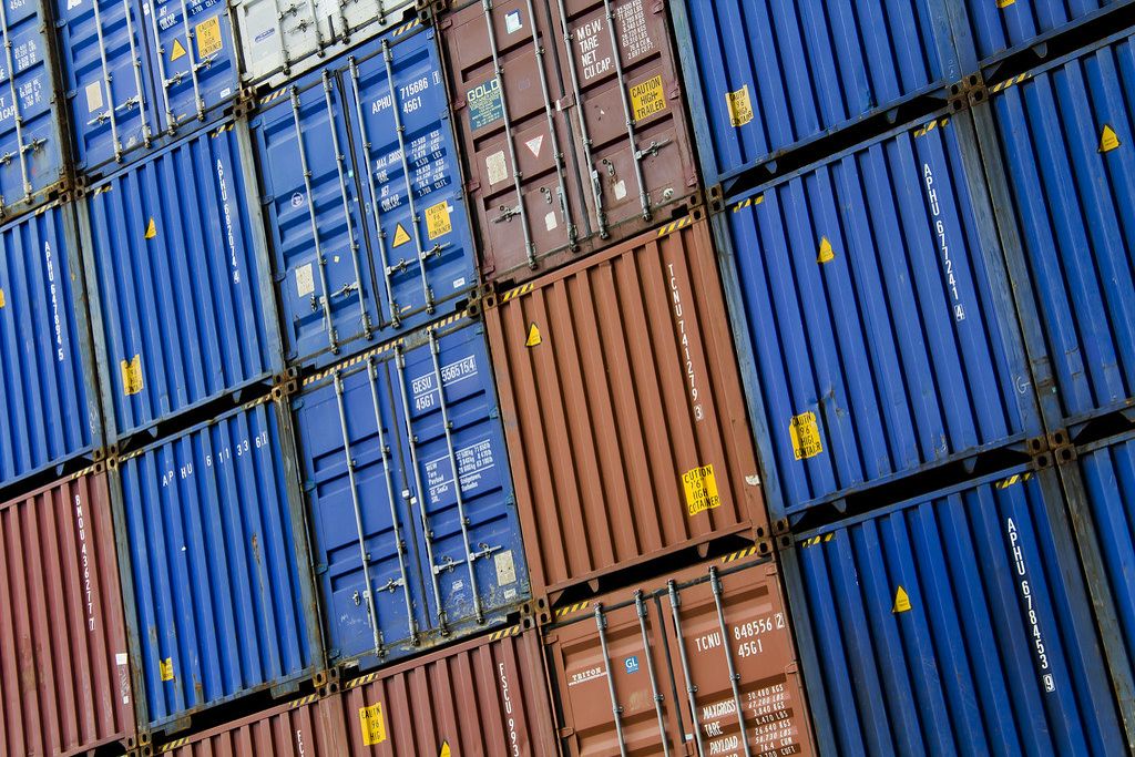 Close view of stacked blue and red shipping containers at the Port of Rotterdam