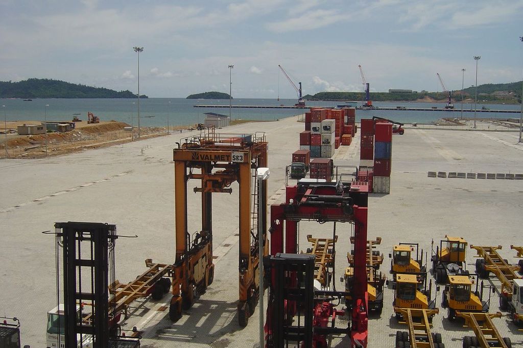 Straddle carriers and container handling equipment at a port